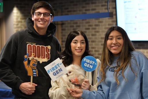 Three students holding up #PSUFirstGen signs